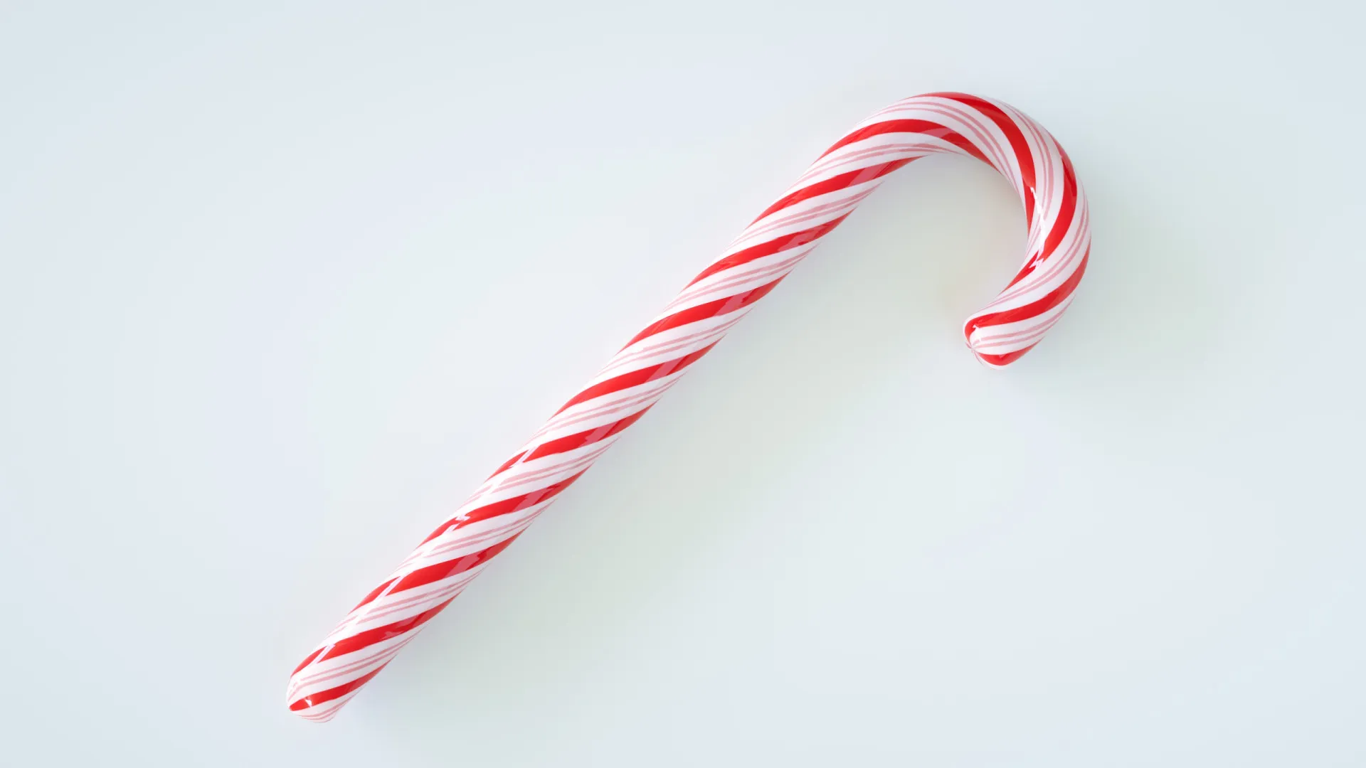 Vários bastões de doces com listras vermelhas e brancas pendurados em uma árvore de Natal.