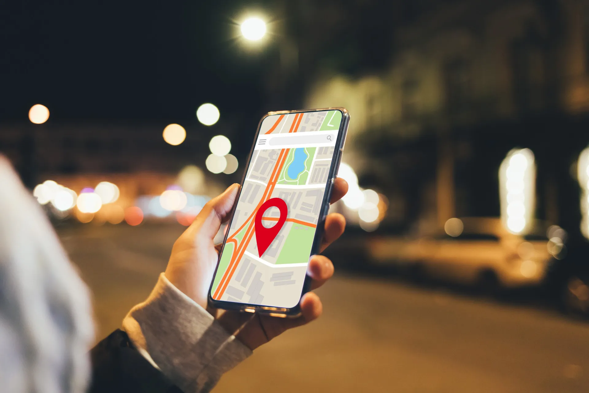 Mapa de uma cidade exibido em um celular, com pinos de localização marcando diversos pontos.