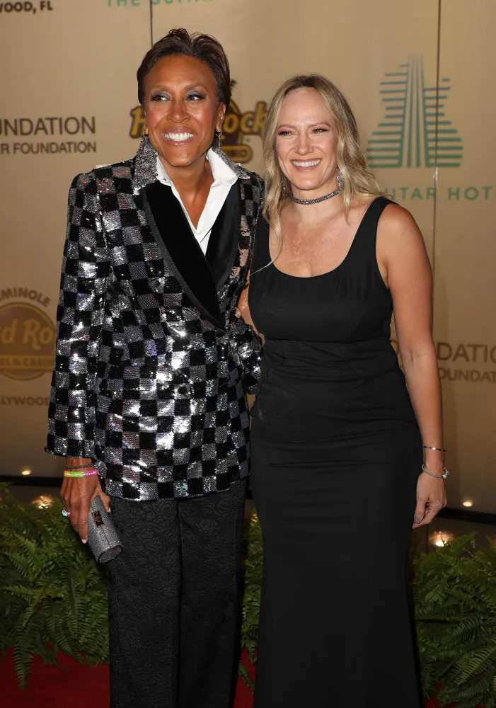 A âncora de TV Robin Roberts e sua esposa, a empresária Amber Laign.
