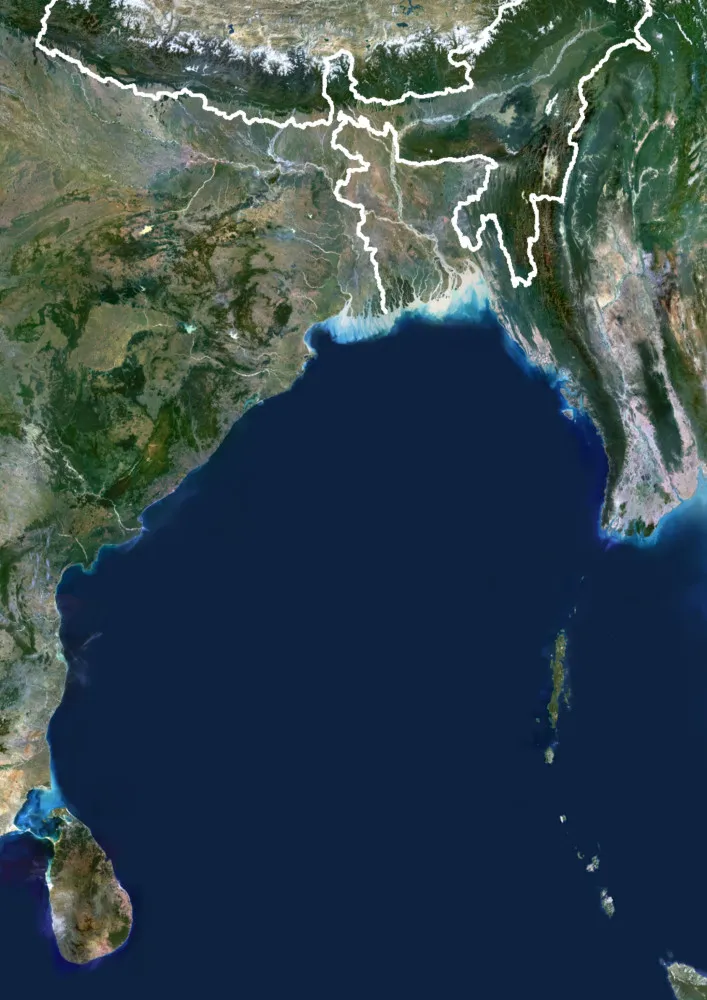 Navios e aeronaves indianos realizando uma vasta operação de busca no oceano.