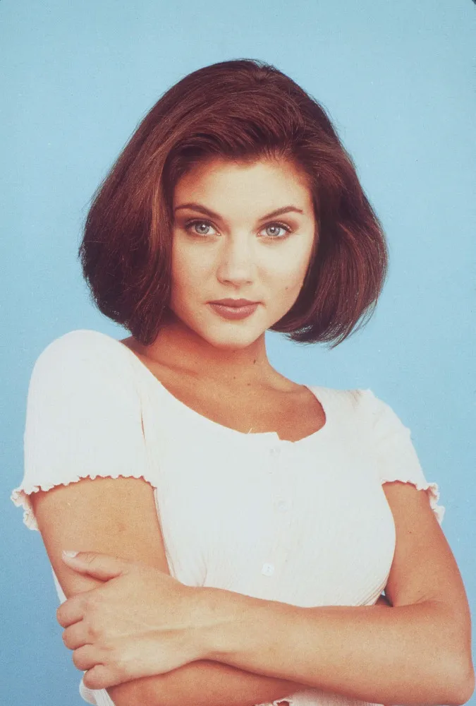 Tiffani Thiessen como a manipuladora e intrigante Valerie Malone.