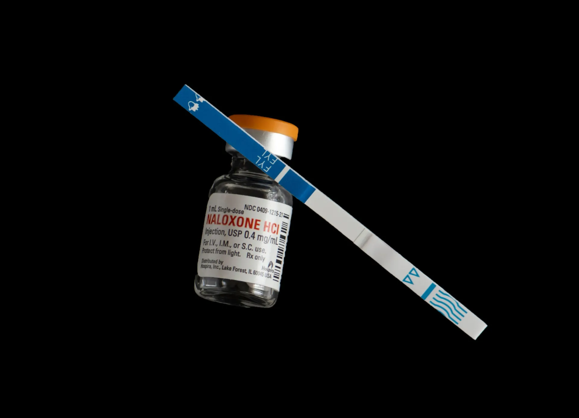 Tiras de teste de fentanil ao lado de um frasco, mostrando como detectar a presença da droga.