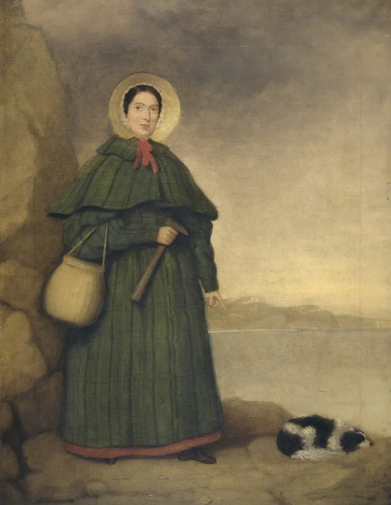 Ilustração de Mary Anning na praia, com seu martelo e cesta, procurando por fósseis.