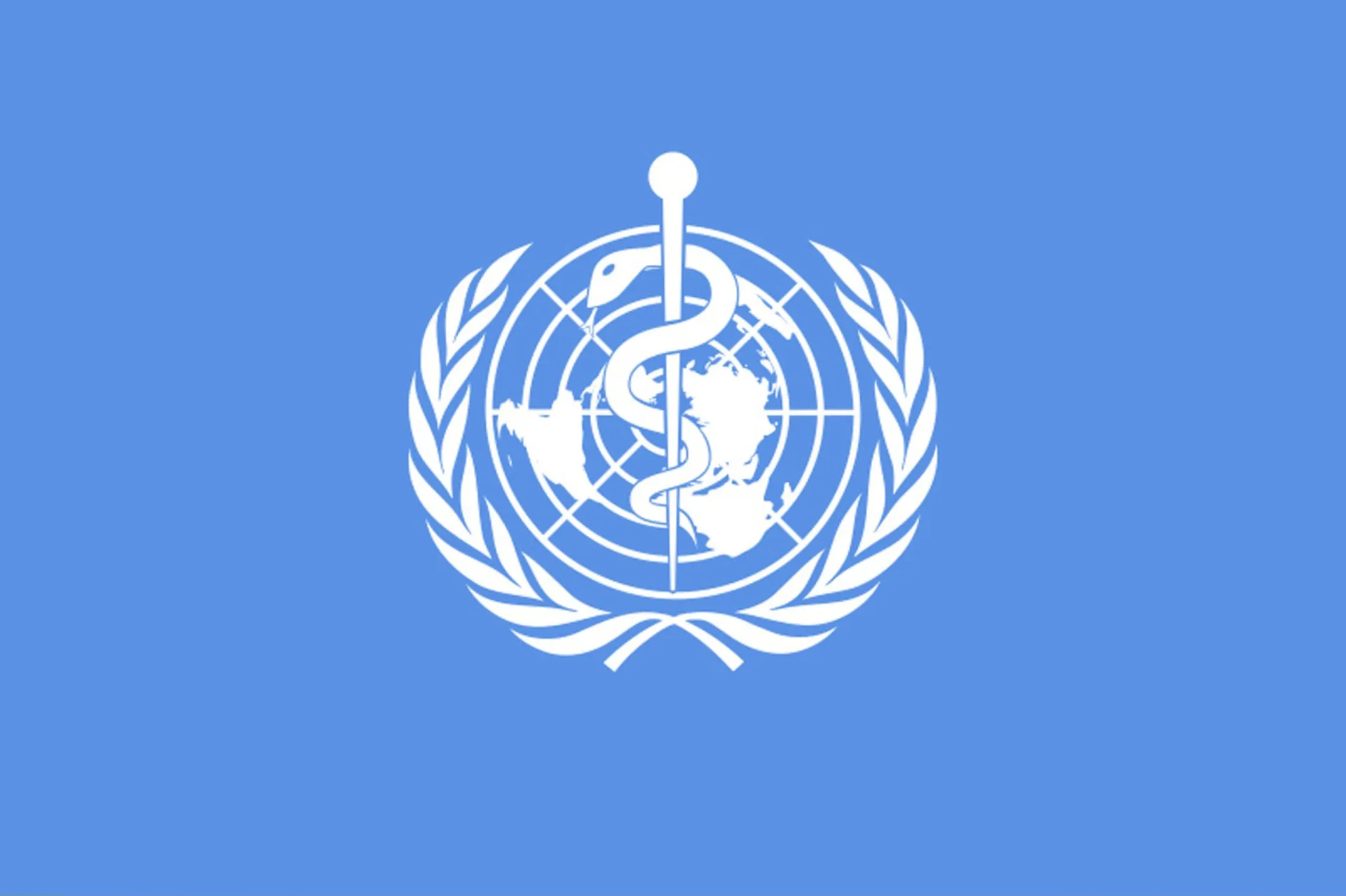 Logotipo da Organização Mundial da Saúde (OMS) em um prédio.