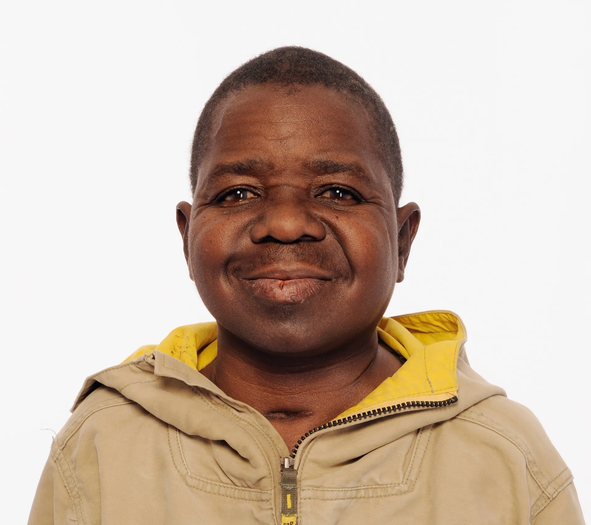 O jovem ator Gary Coleman sorrindo, no auge de sua fama como Arnold Jackson.