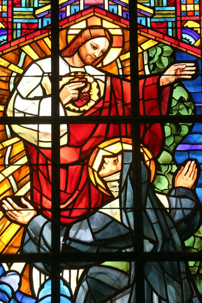Ilustração do Sagrado Coração de Jesus, com chamas e uma coroa de espinhos.